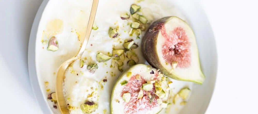 Figs on a creamy pillow of french yogurt & honeycomb topped with pistachios