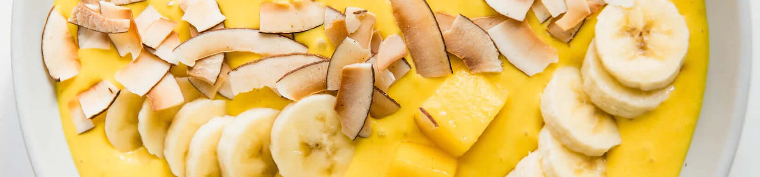 Creamy mango turmeric probiotic smoothie bowl